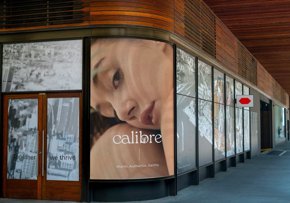 Large Calibre campaign poster in a storefront window