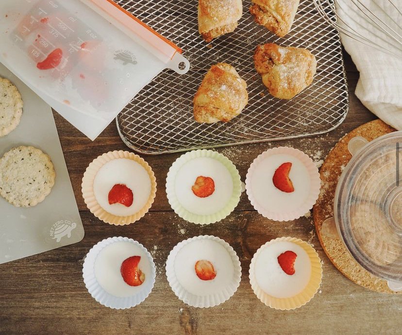 Homemade snacks and strawberry treats with reusable silicone bags